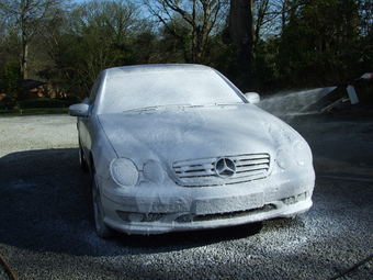 Car gets snow foam pre-wash.