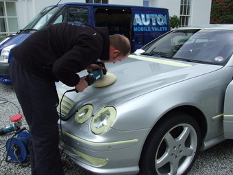 Polishing the car to a high gloss finish
